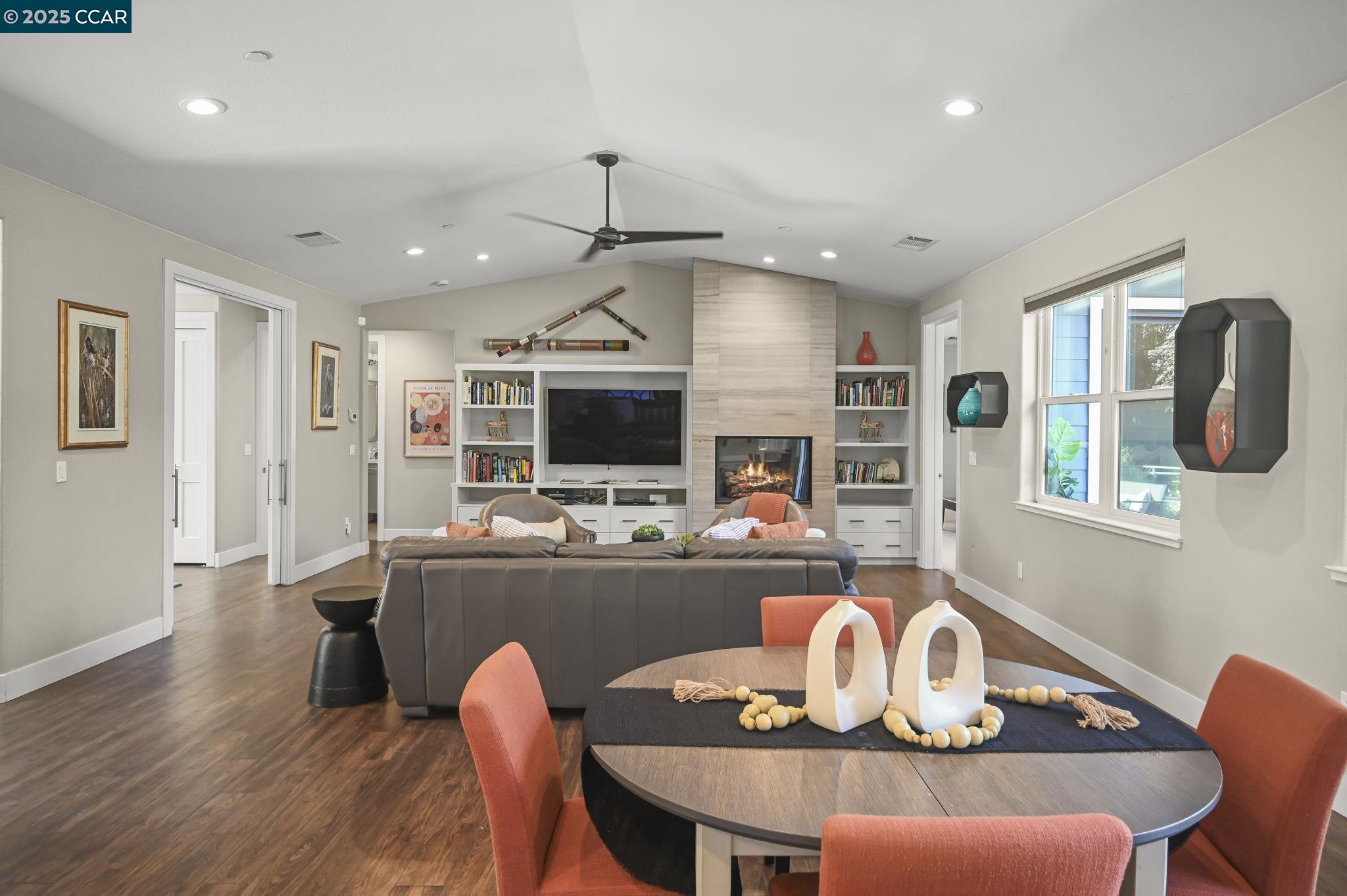 1096 Mountain View Boulevard Walnut Creek, CA 94596 - Photo 7 of 49 a living room with furniture kitchen view and a wooden floor