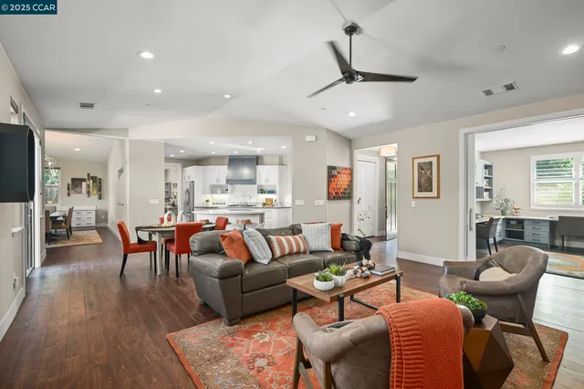 a view of a lake with furniture and garden