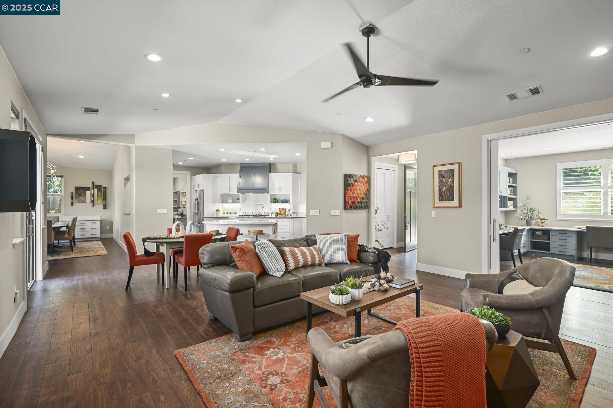 1096 Mountain View Boulevard Walnut Creek, CA 94596 - Photo 8 of 49 a living room with furniture a ceiling fan and a rug