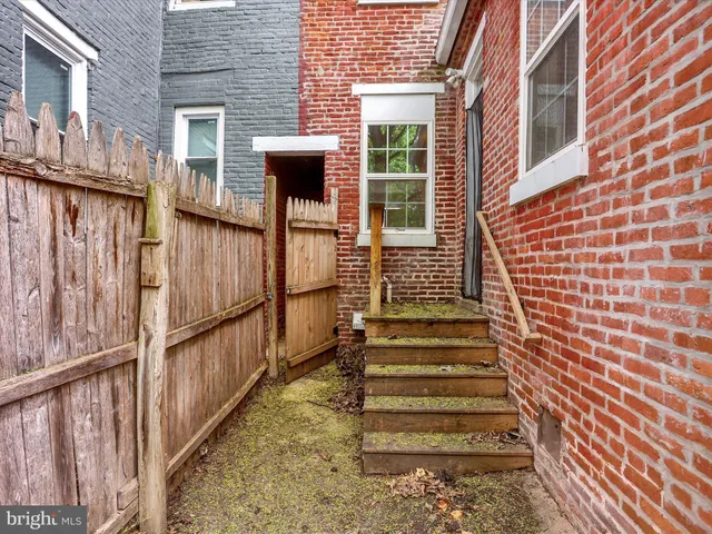 a view of a brick house with a window