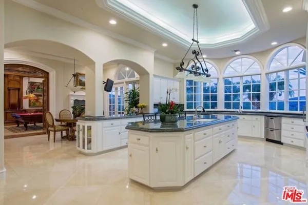a living room with granite countertop furniture and fireplace