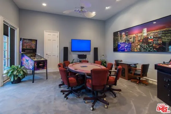 a view of a livingroom with furniture and a flat screen tv