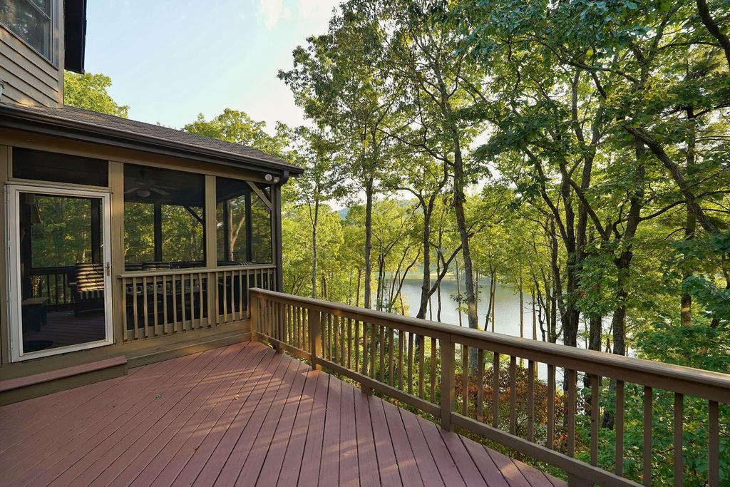 a view of balcony with wooden floor