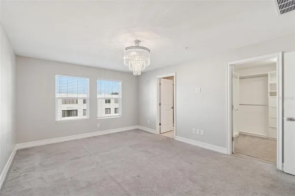 a bathroom with a sink toilet vanity and shower