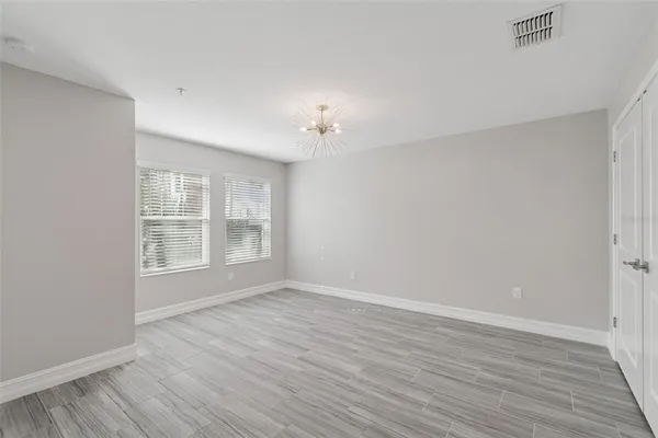 a bathroom with a granite countertop toilet and a sink