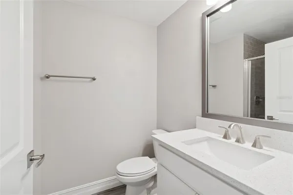 a bathroom with a glass shower door