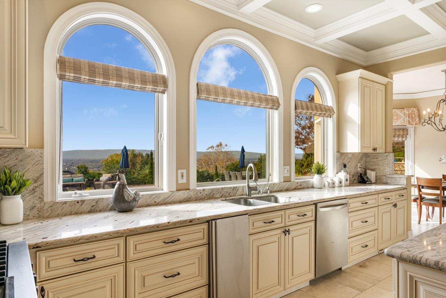 10340 Anderson Road San Jose, CA 95127 - Photo 11 of 65 a bathroom with a granite countertop sink a mirror a window and a bathtub