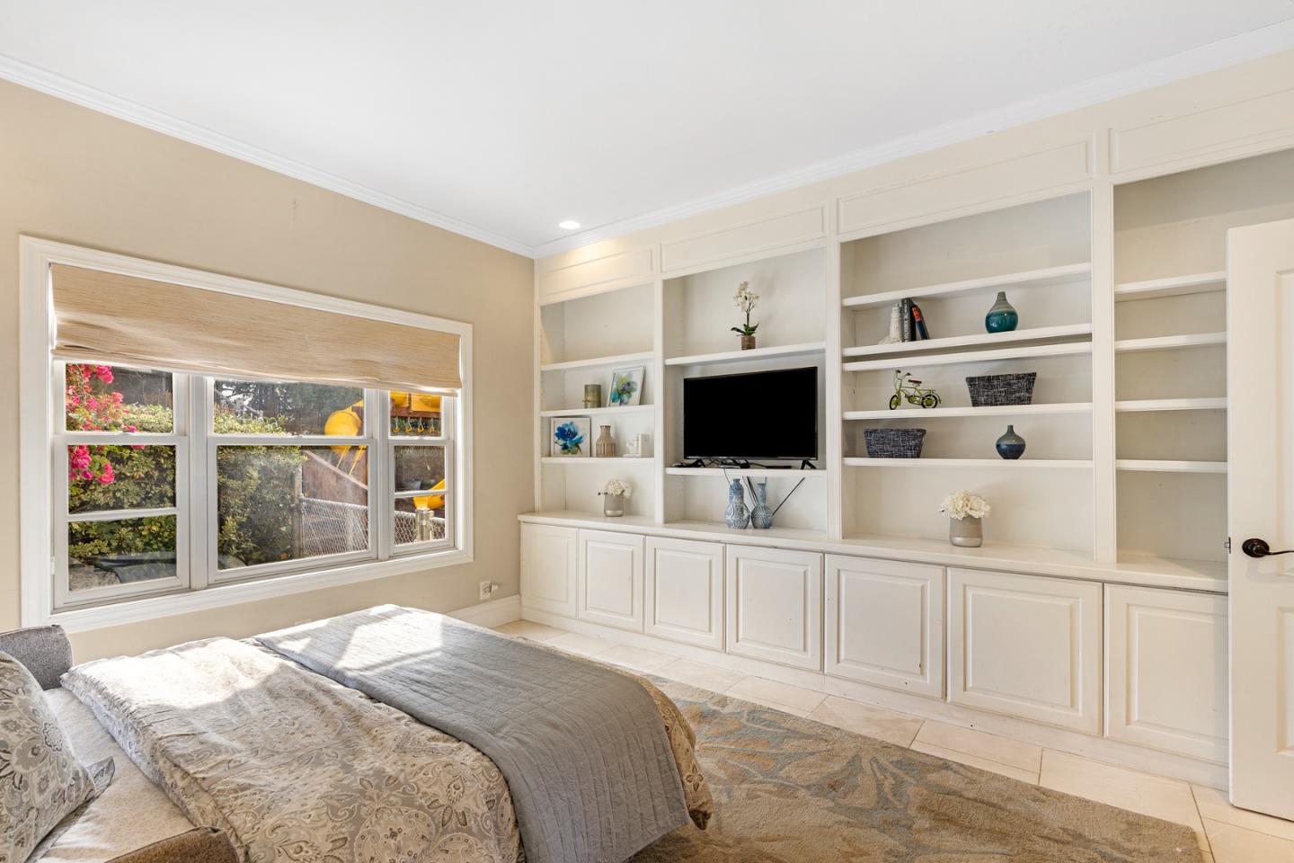 10340 Anderson Road San Jose, CA 95127 - Photo 27 of 65 a bedroom with a bed and a flat screen tv