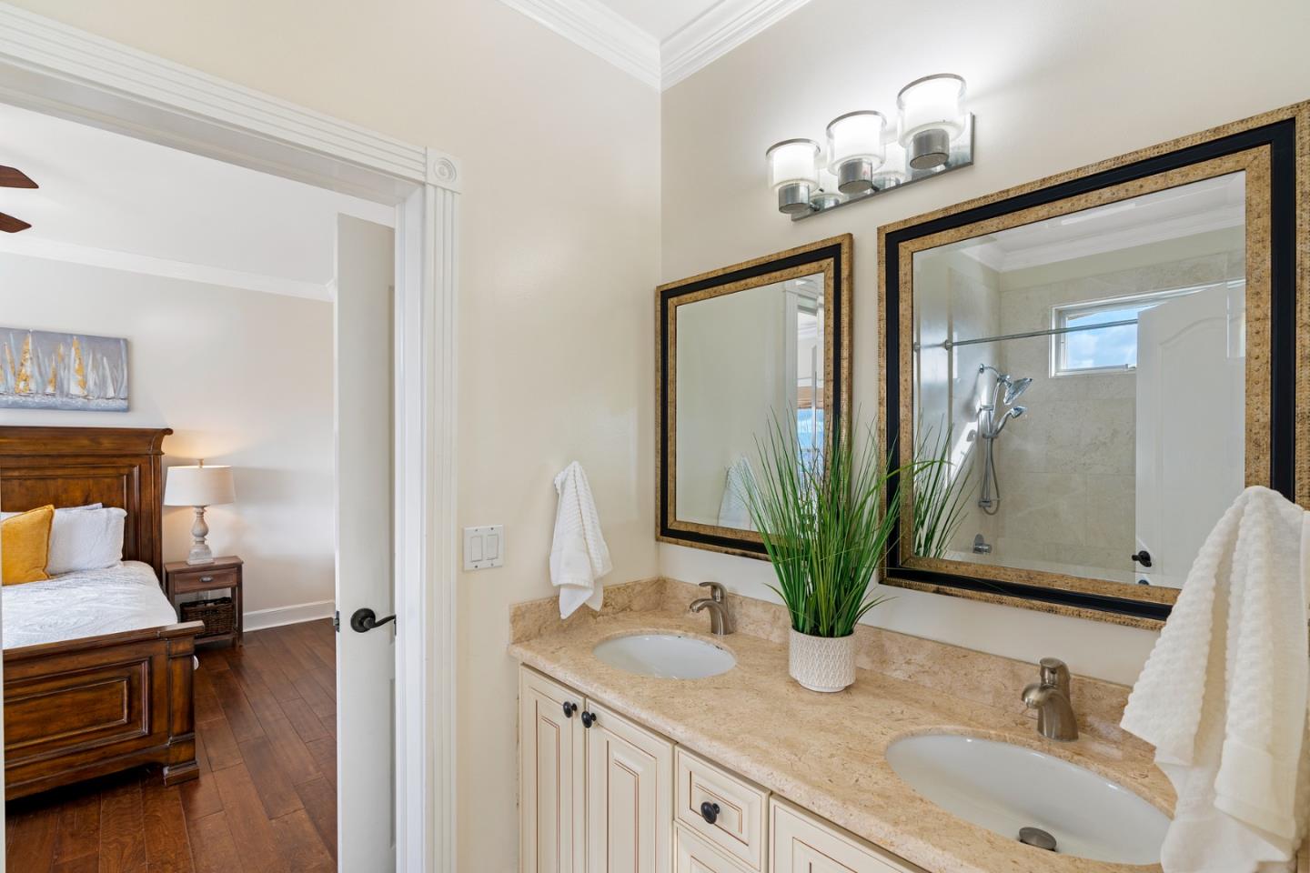 10340 Anderson Road San Jose, CA 95127 - Photo 29 of 65 a bathroom with a granite countertop sink a potted plant and a mirror