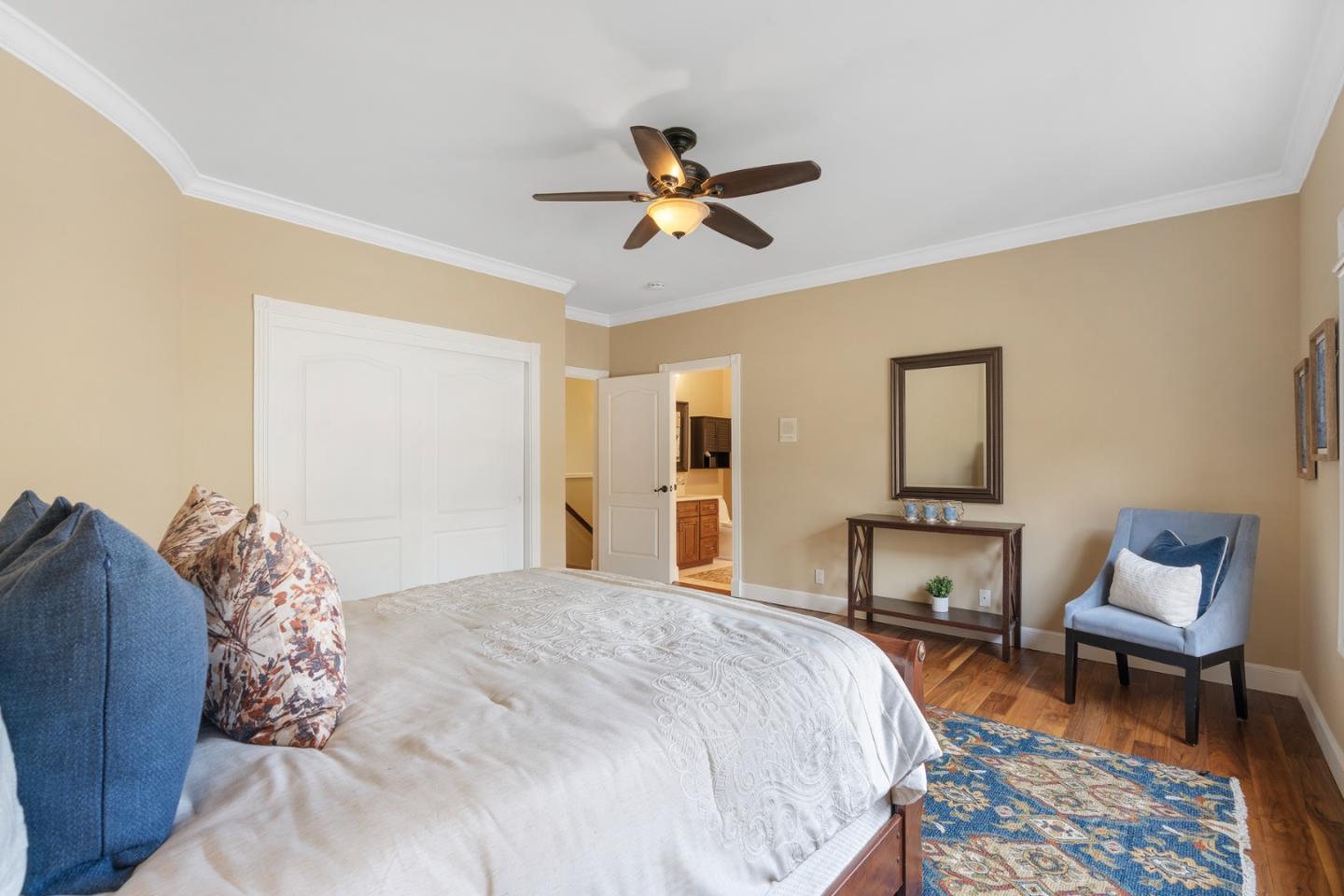 10340 Anderson Road San Jose, CA 95127 - Photo 32 of 65 a bedroom with a bed a chair and a potted plant