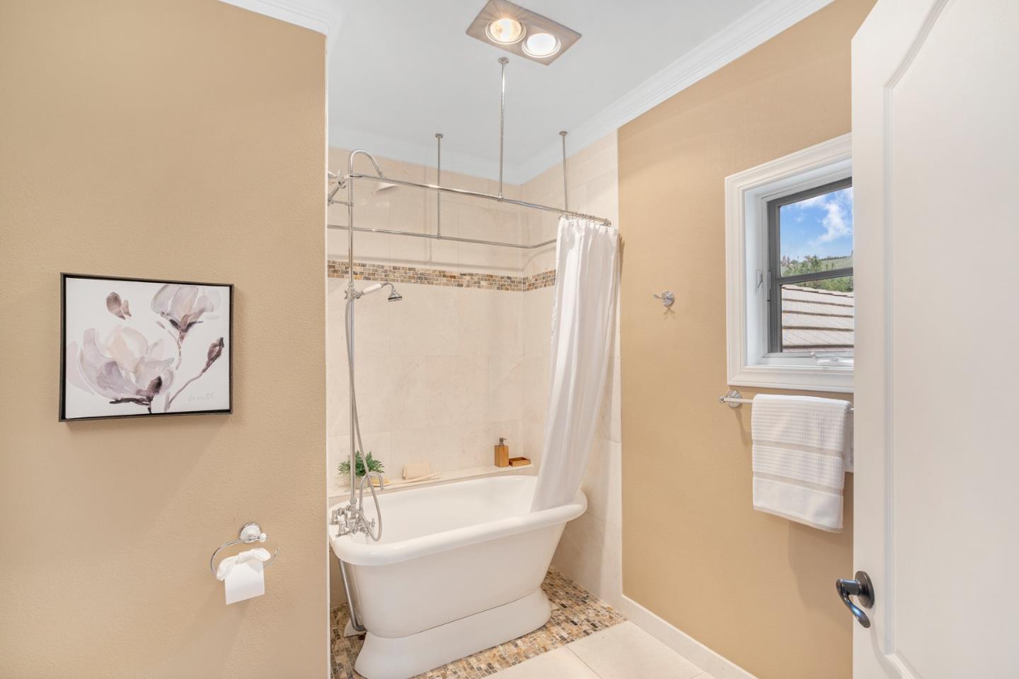 10340 Anderson Road San Jose, CA 95127 - Photo 34 of 65 a bathroom with a bathtub and a shower
