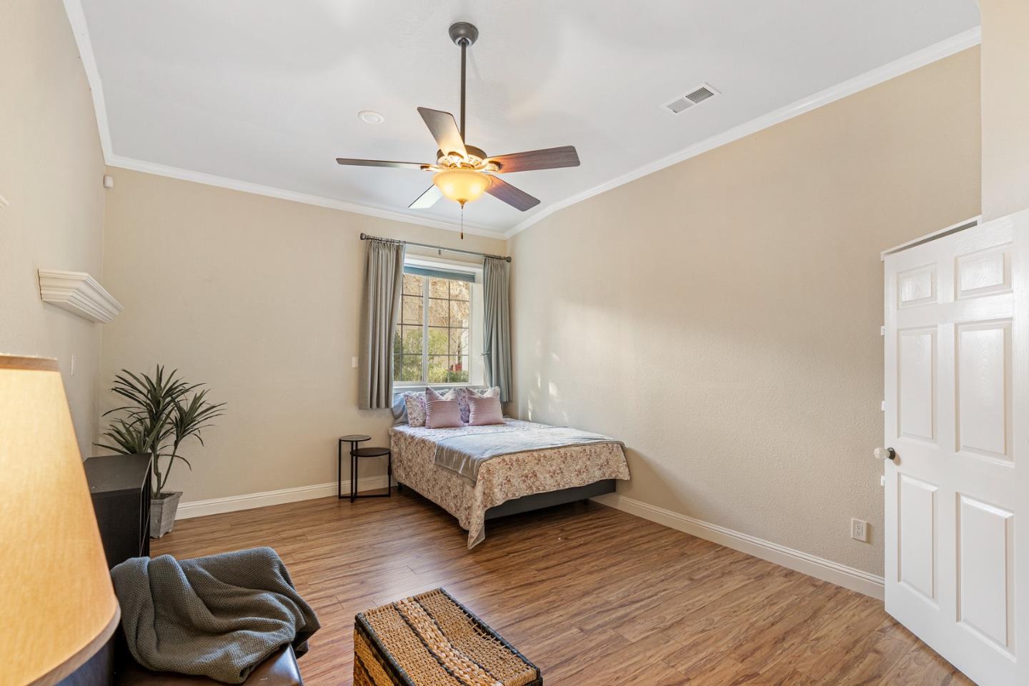 10340 Anderson Road San Jose, CA 95127 - Photo 64 of 65 a bedroom with a bed and wooden floor