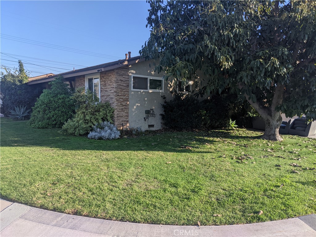 202 South Agate Street Anaheim, CA 92804 - Photo 2 of 15 a view of a house with garden and yard