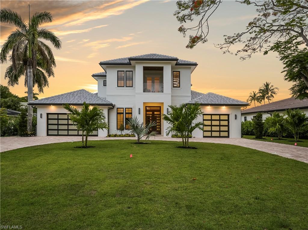2115 Crayton Road Naples, FL 34102 - Photo 1 of 9 a view of a house with a yard