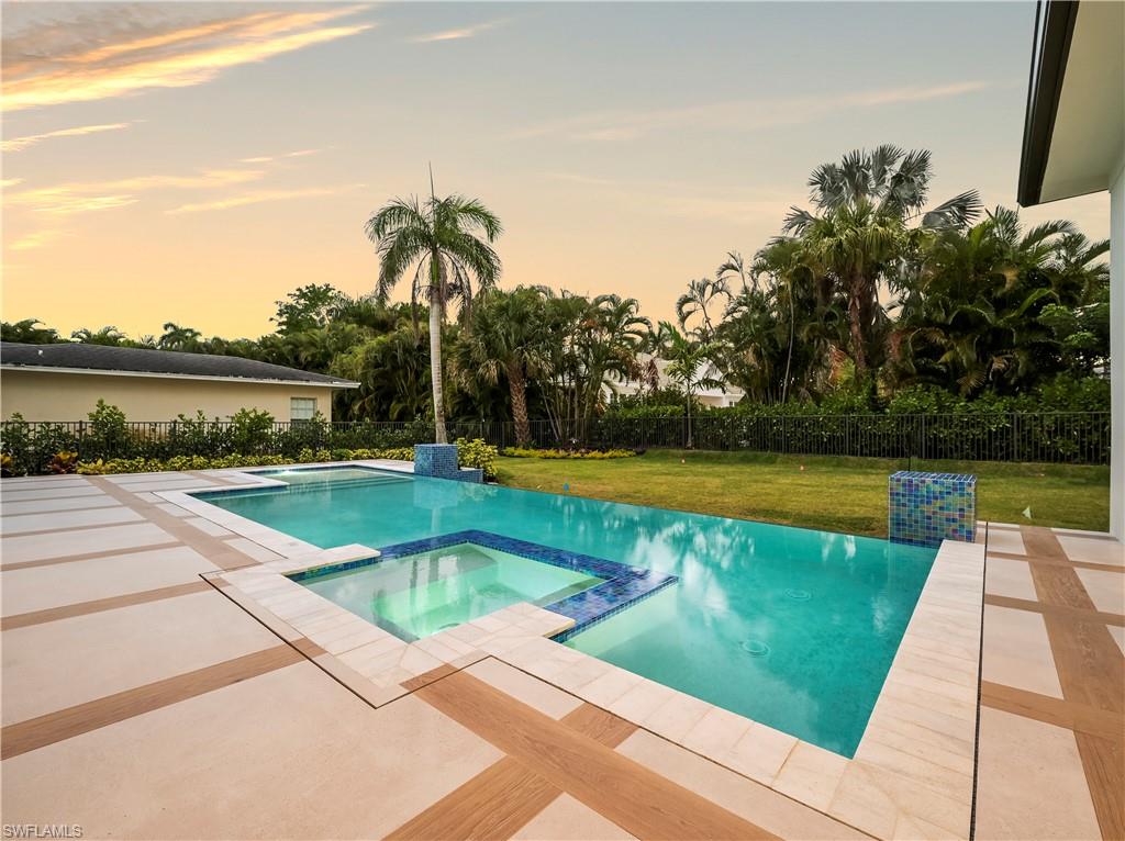 2115 Crayton Road Naples, FL 34102 - Photo 8 of 9 a view of swimming pool with a lake view