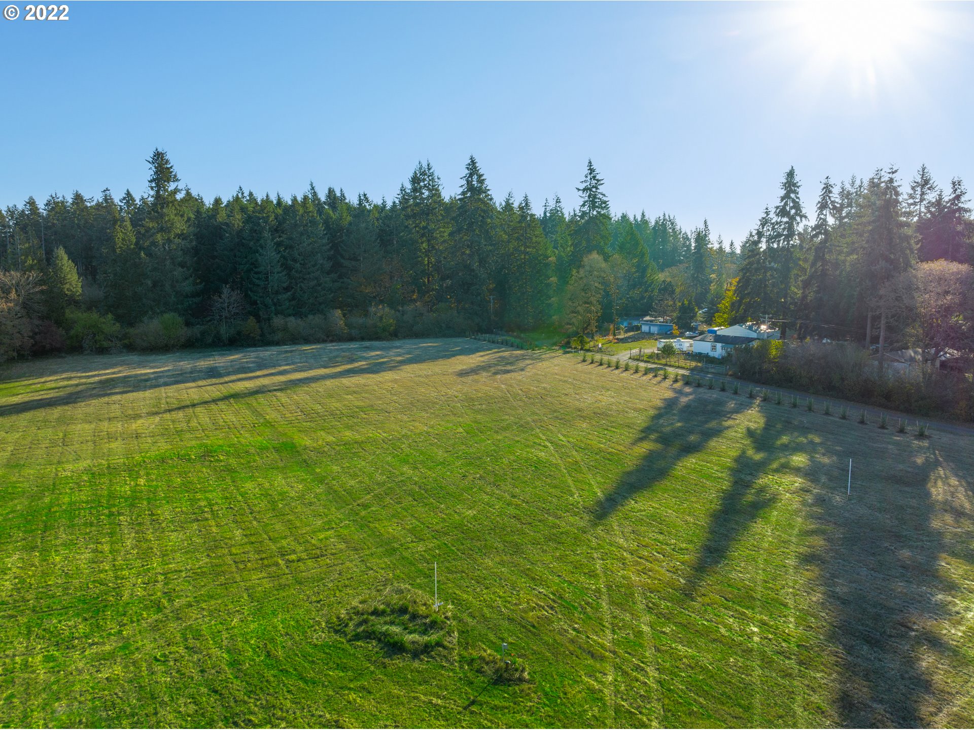 0 Northwest 71st Avenue, Unit 2 Ridgefield, WA 98642 - Photo 7 of 12 a view of a swimming pool and trees in the background