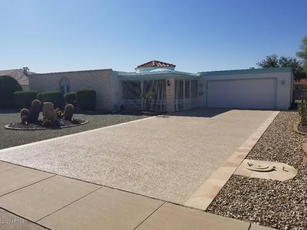 a bedroom with a bed and a night stand