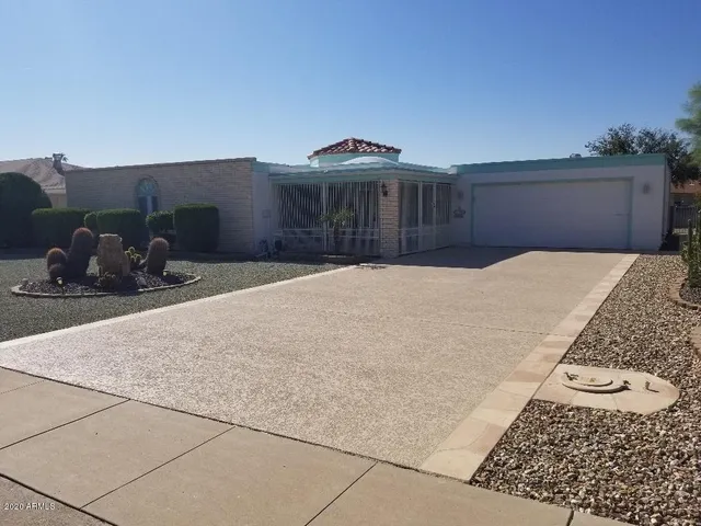 a bedroom with a bed and a night stand