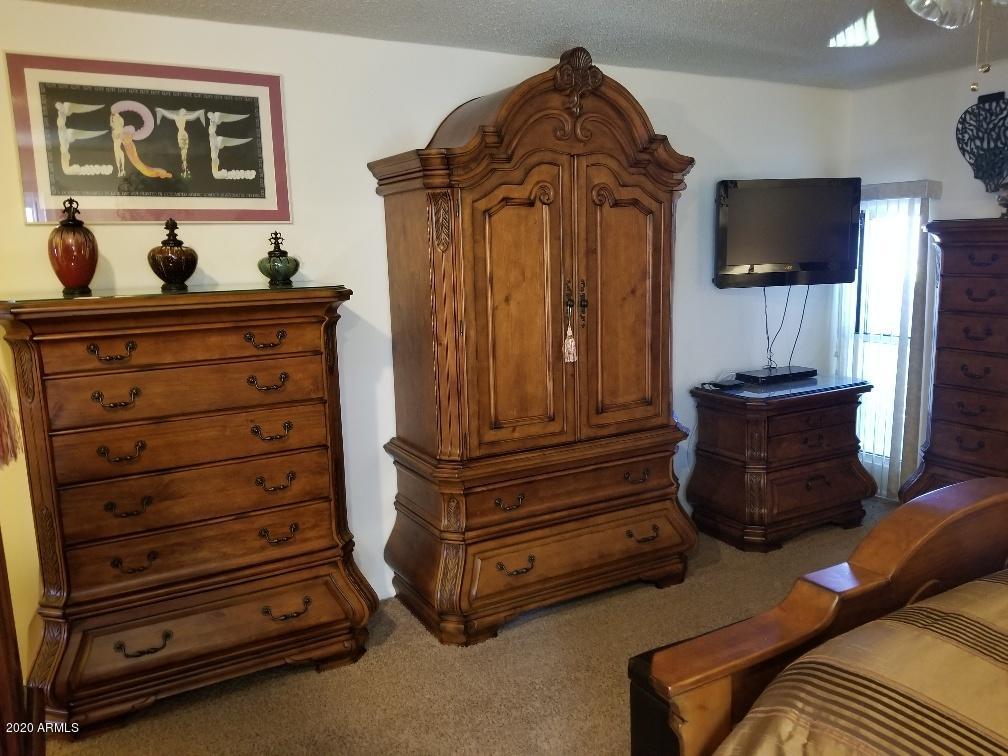 10249 West Burns Drive Sun City, AZ 85351 - Photo 14 of 30 a living room with furniture and a flat screen tv