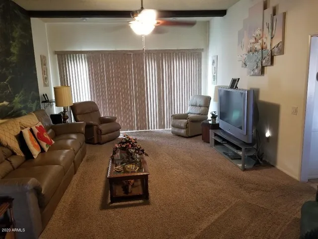 a living room with furniture and a window