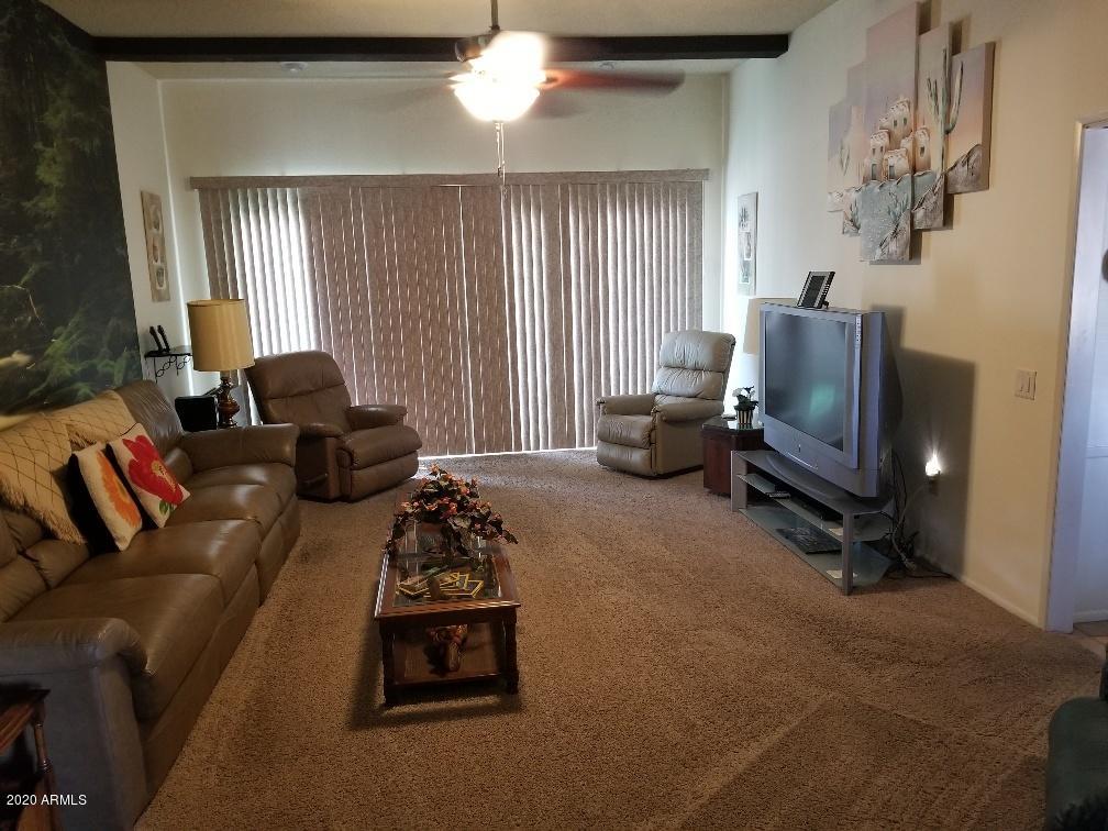 10249 West Burns Drive Sun City, AZ 85351 - Photo 15 of 30 a living room with furniture and a window