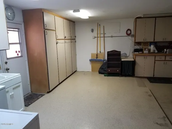 a kitchen with refrigerator a stove a microwave and cabinets