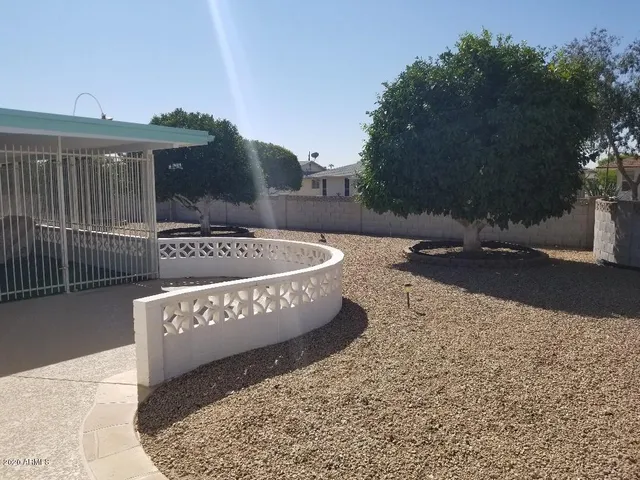 a view of a chairs and table in the patio