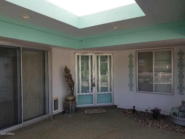 a room with gym equipment and a large window