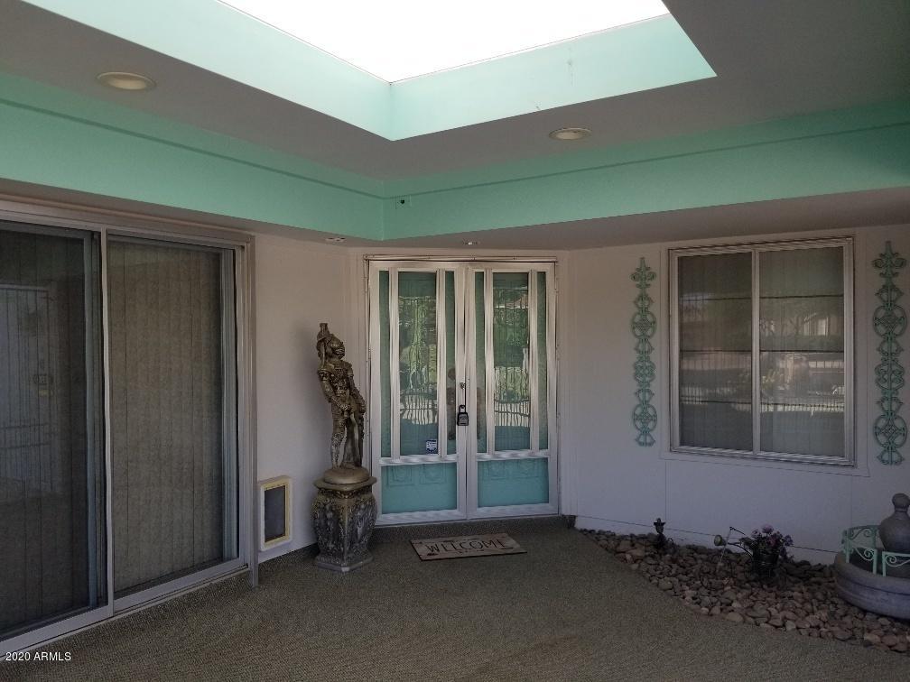 10249 West Burns Drive Sun City, AZ 85351 - Photo 5 of 30 a room with gym equipment and a large window