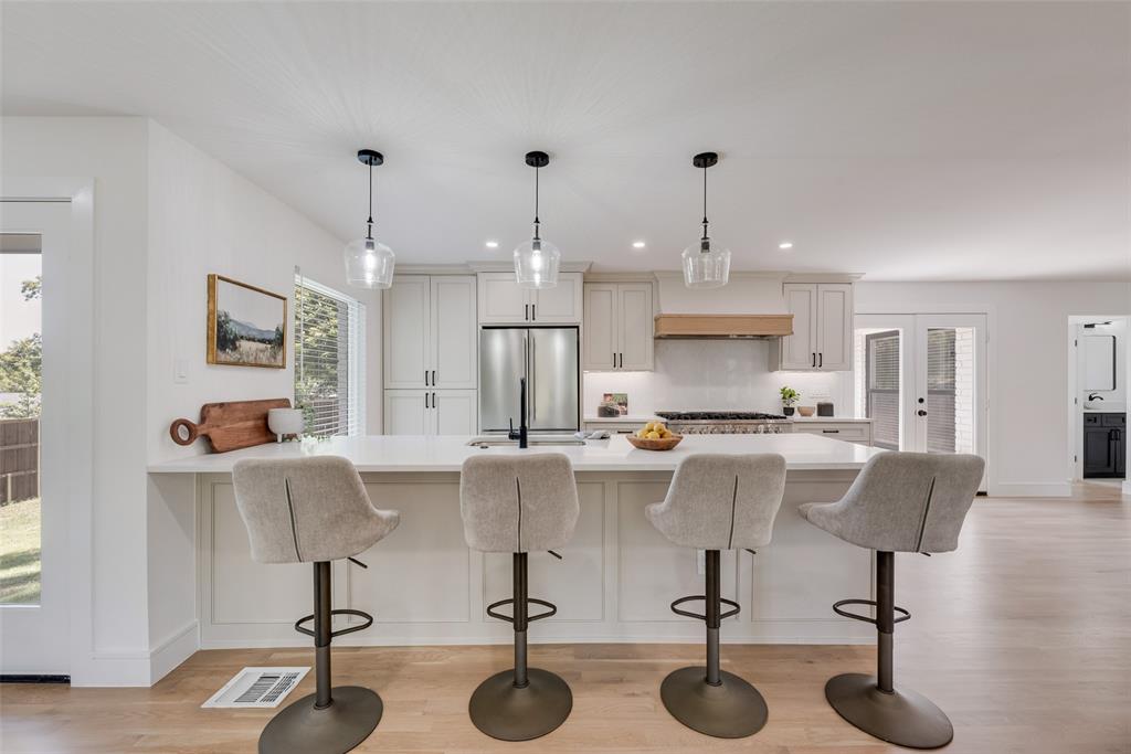 9662 Angleridge Road Dallas, TX 75238 - Photo 16 of 30 a view of kitchen with dining table and chairs