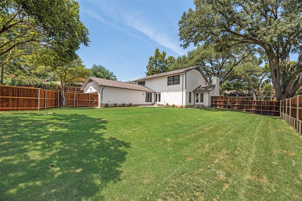 9662 Angleridge Road Dallas, TX 75238 - Photo 29 of 30 a front view of house with a garden