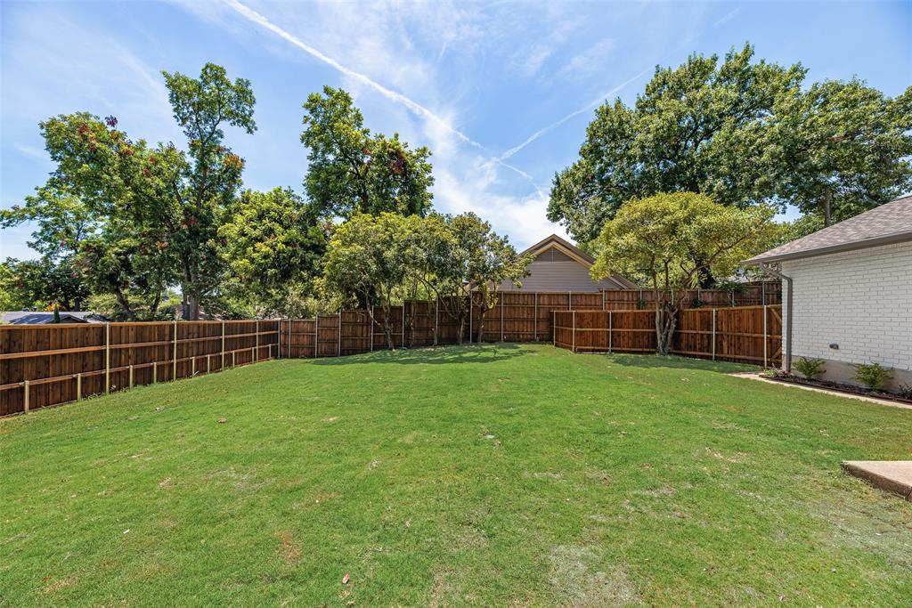 9662 Angleridge Road Dallas, TX 75238 - Photo 30 of 30 a backyard of a house with lots of green space