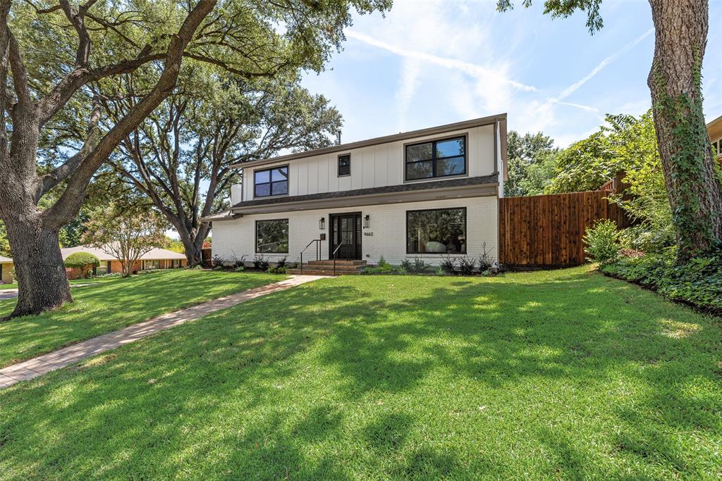9662 Angleridge Road Dallas, TX 75238 - Photo 4 of 30 front view of a house with a yard