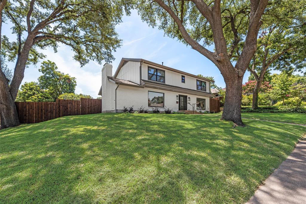 9662 Angleridge Road Dallas, TX 75238 - Photo 6 of 30 a front view of house with yard and green space