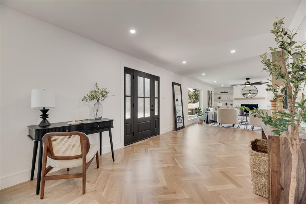 9662 Angleridge Road Dallas, TX 75238 - Photo 8 of 30 a view of a livingroom with furniture and a potted plant
