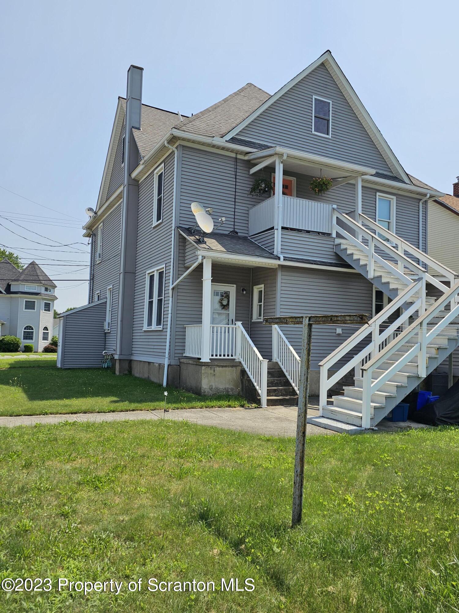 226 Spring Street Moosic, PA 18507 - Photo 4 of 25 a view of a house with a yard