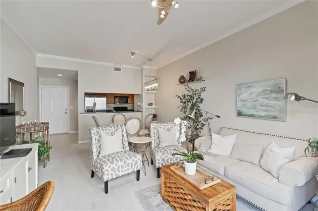 a living room with furniture and flat screen tv