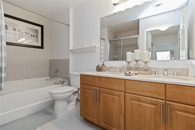 a bathroom with a shower and a bath tub
