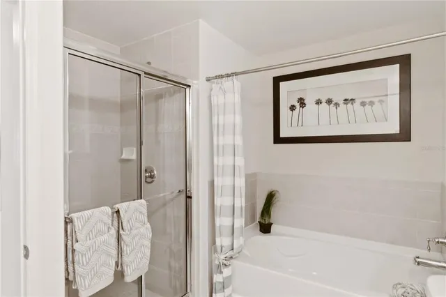 a bedroom with furniture and a chandelier