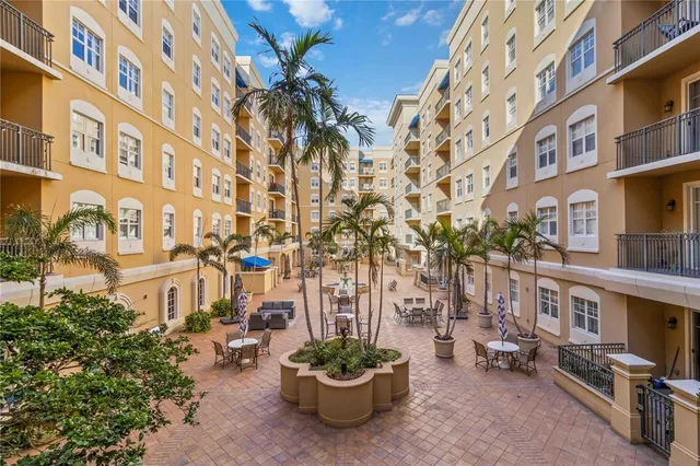 a dining room with furniture and chandelier