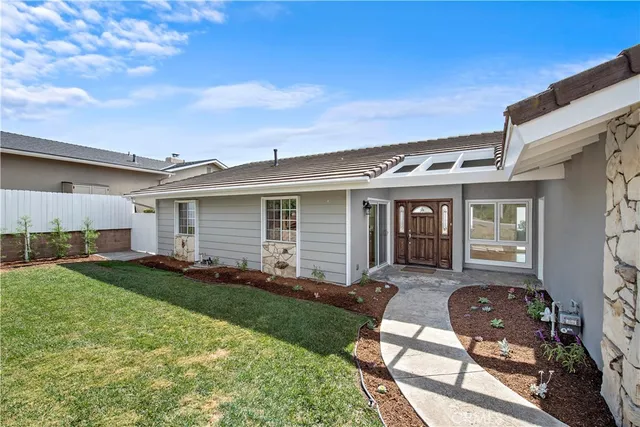 front view of a house with a yard