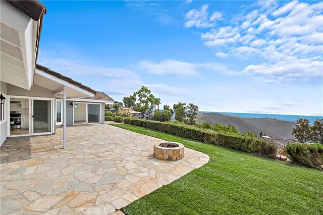 a view of a house with backyard porch and garden