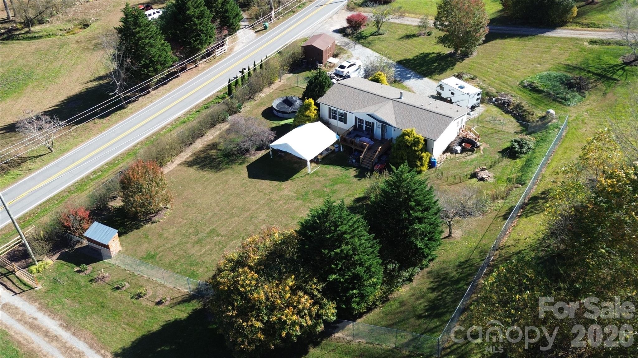 703 Garren Creek Road Fairview, NC 28730 - Photo 12 of 48 an aerial view of a house with a yard