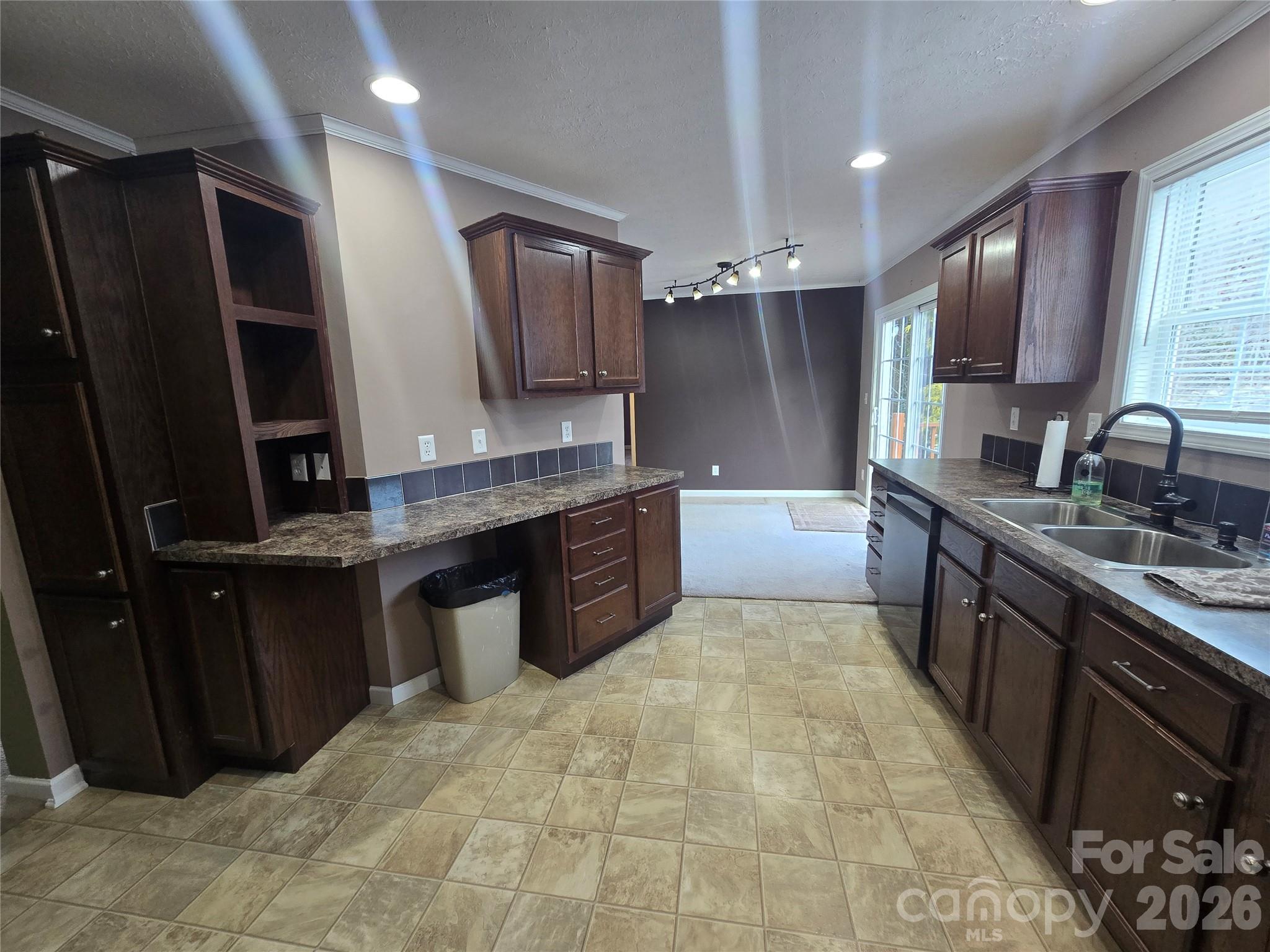 703 Garren Creek Road Fairview, NC 28730 - Photo 19 of 48 a large kitchen with kitchen island granite countertop a sink and dishwasher a stove top oven with wooden floor