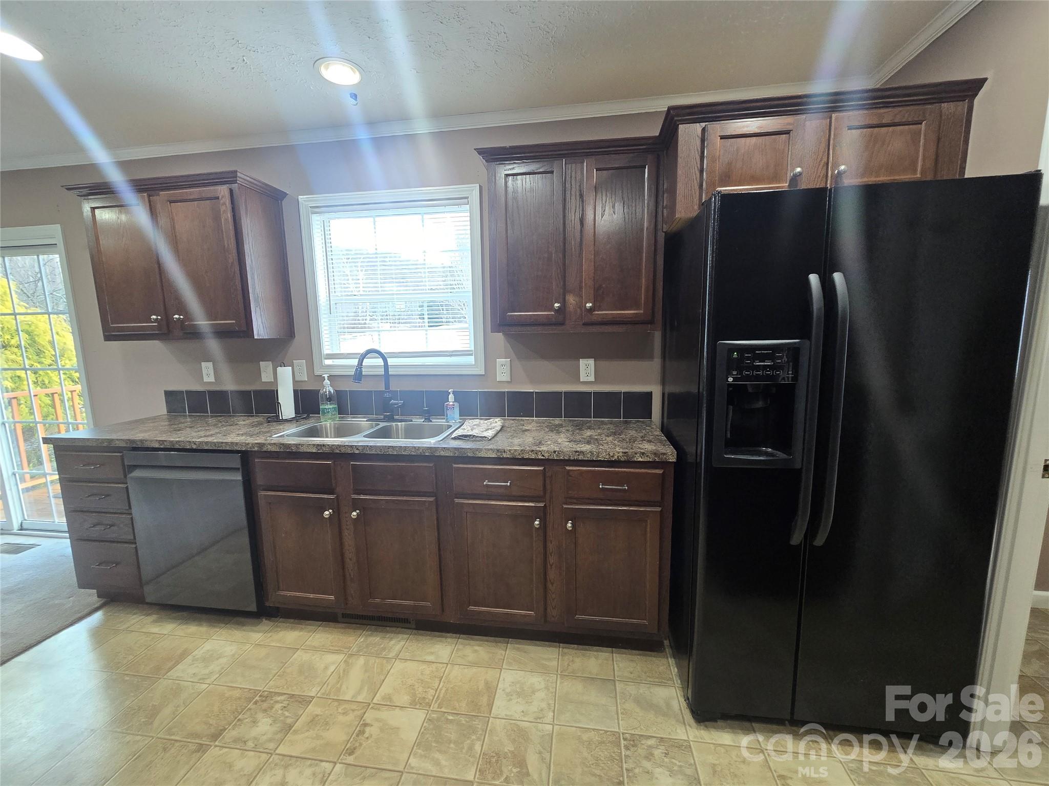 703 Garren Creek Road Fairview, NC 28730 - Photo 21 of 48 a kitchen with stainless steel appliances granite countertop a refrigerator and a sink