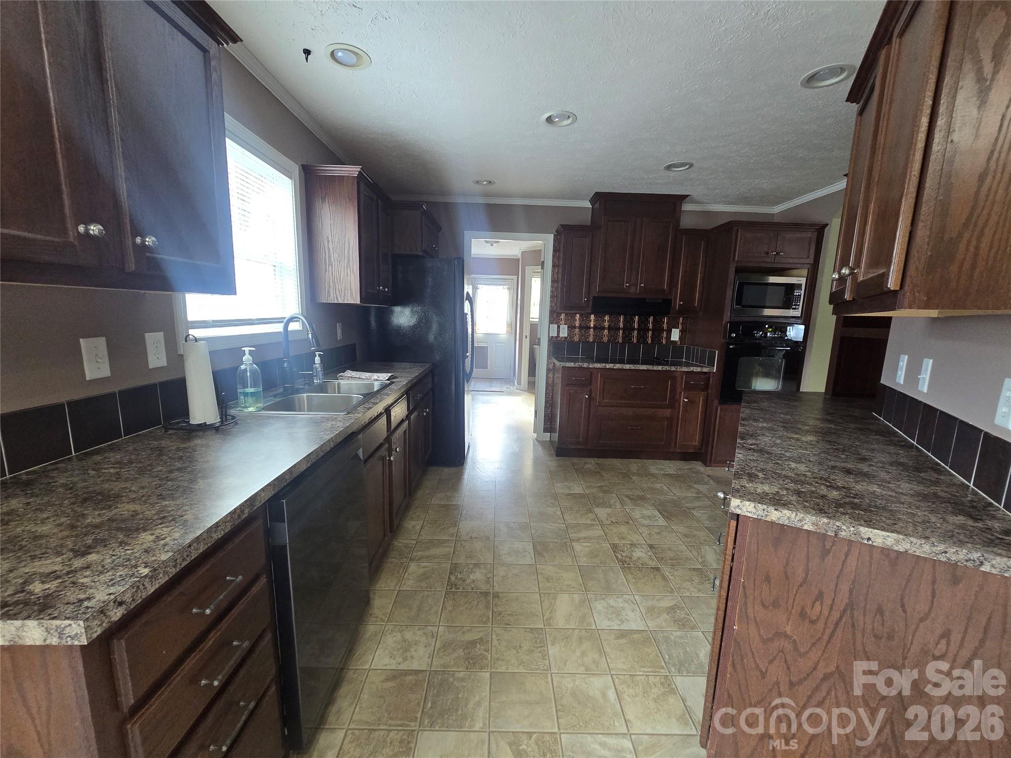 703 Garren Creek Road Fairview, NC 28730 - Photo 22 of 48 a large kitchen with a large counter top appliances and cabinets
