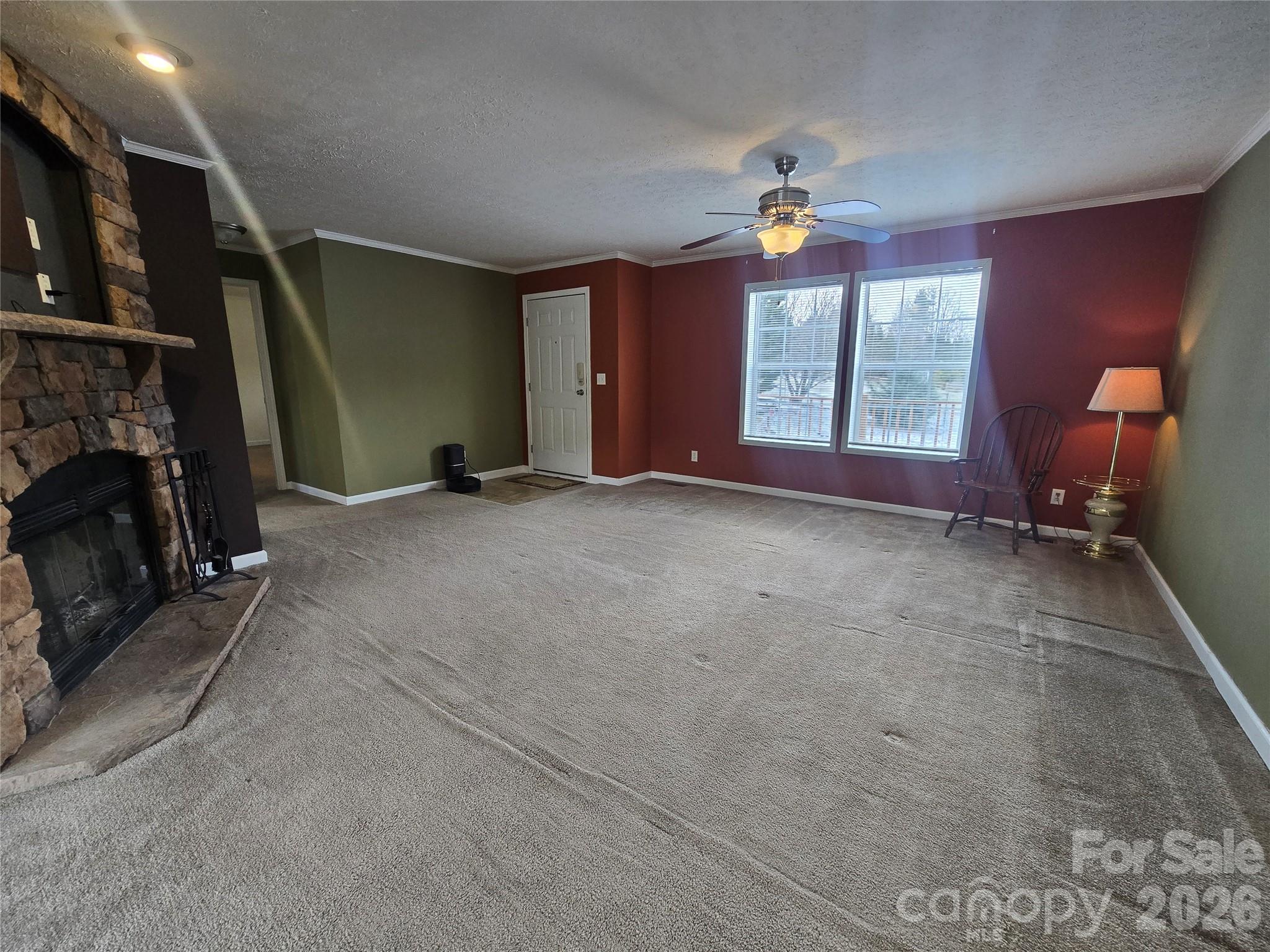 703 Garren Creek Road Fairview, NC 28730 - Photo 26 of 48 a view of empty room with window and fireplace