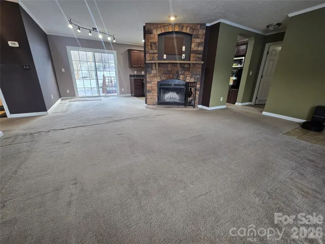 a bathroom with a granite countertop sink toilet a mirror and shower