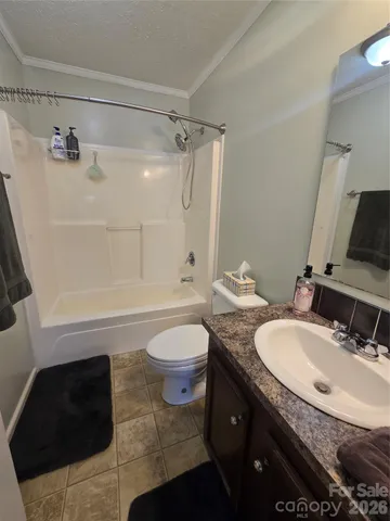 a view of livingroom with furniture and chandelier fan