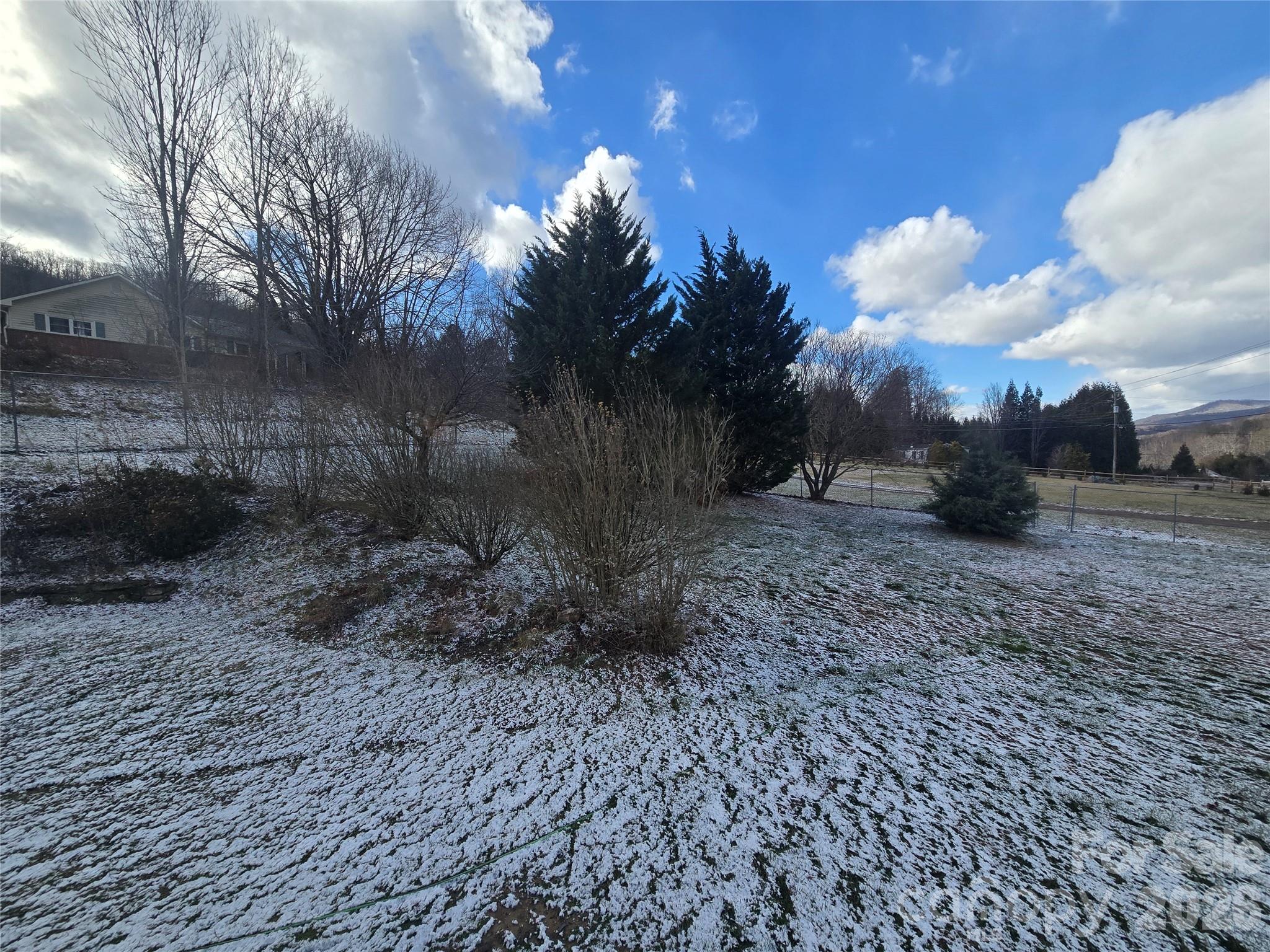 703 Garren Creek Road Fairview, NC 28730 - Photo 42 of 48 a view of a backyard with green space